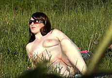 beautiful brunette milf masturbates naked on beach