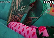 Skinny tattoo girl plays with her anal hole using sextoy