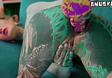 Skinny tattoo girl plays with her anal hole using sextoy