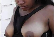 Big booty redbone ebony with nice tits spreads outdoors