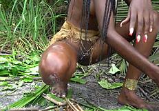 hot african native woman cooking in the jungle