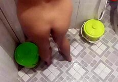 teen takes shower in bathroom while showing her body