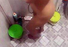 teen takes shower in bathroom while showing her body