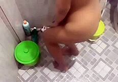 teen takes shower in bathroom while showing her body