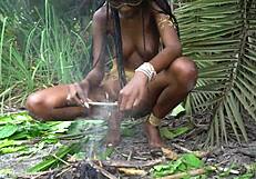 hot african native woman cooking in the jungle