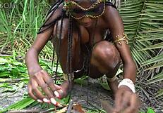 hot african native woman cooking in the jungle