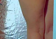 COLLEGE DESI IN SEXY DRESS AND SNEAKERS PLAYS WITH GLASS DILDO
