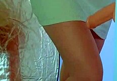COLLEGE DESI IN SEXY DRESS AND SNEAKERS PLAYS WITH GLASS DILDO