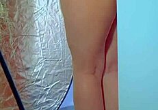 COLLEGE DESI IN SEXY DRESS AND SNEAKERS PLAYS WITH GLASS DILDO