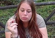 my wife smoking a cigarette in the bedroom