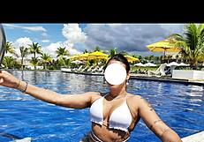 curvy brazilian relaxes poolside wearing tiny bikini