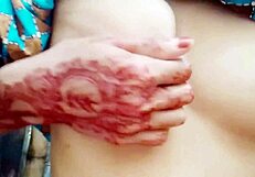 Village girl fingers her small tits in bathroom