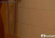 brunette with tattoos has a nice shower