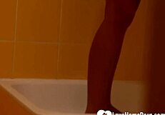 brunette with tattoos has a nice shower