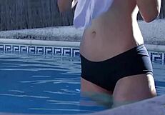 Redhead gets in mood during pool photoshoot