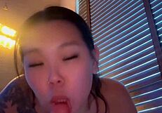 Asian mistress gives sloppy dildo blowjob while girlfriend is at work