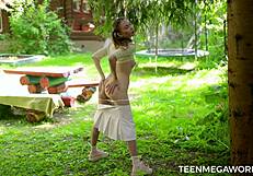naughty girl masturbates naked on outdoor bench